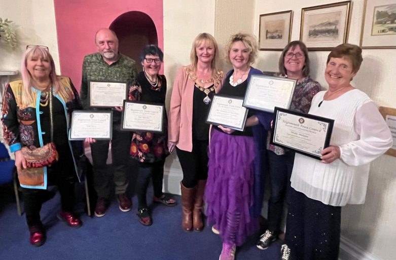 Representatives of our volunteer team receiving recognition alongside the Mayor of Teignmouth